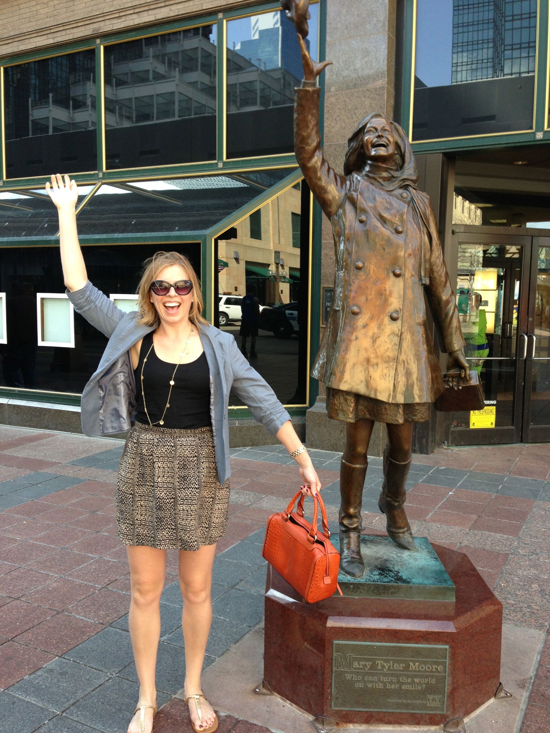 Christine Huberty next to the statue of Mary Tyler Moore on Nicollet Mall in downtown MInneapolus