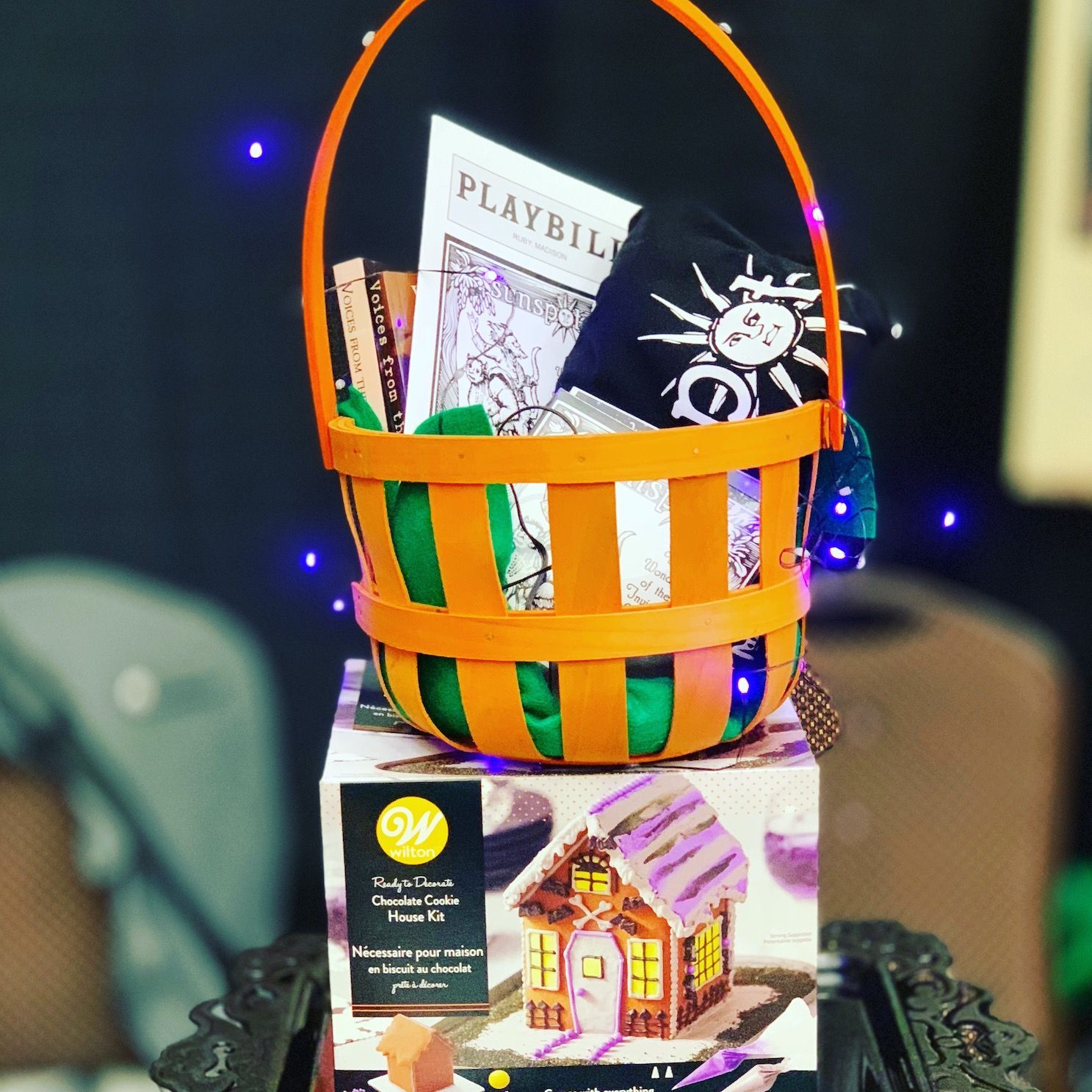 A basket with a playbill on top of it