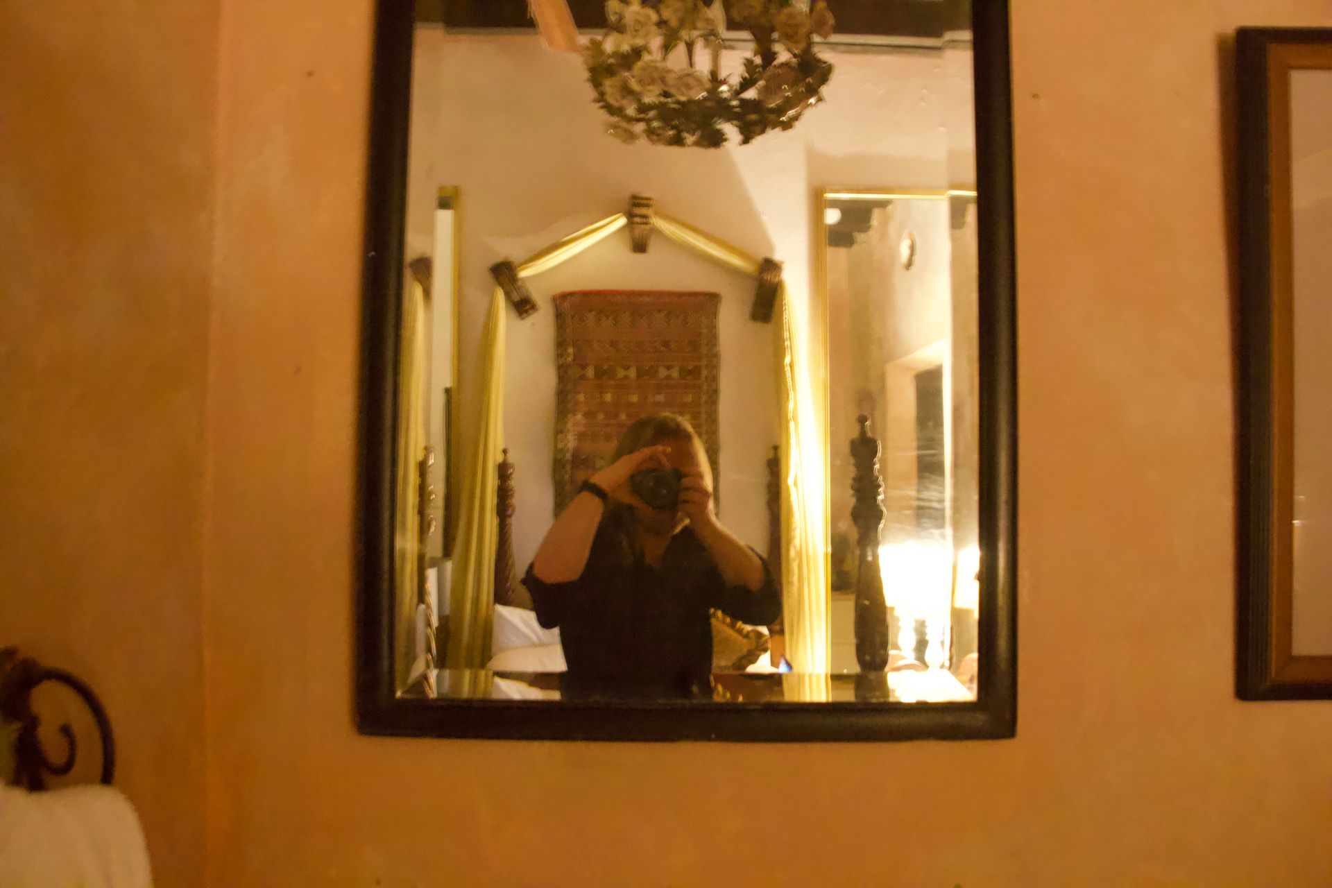 Looking for ghosts in the mirror of the Gallery Inn in San Juan, Puerto Rico