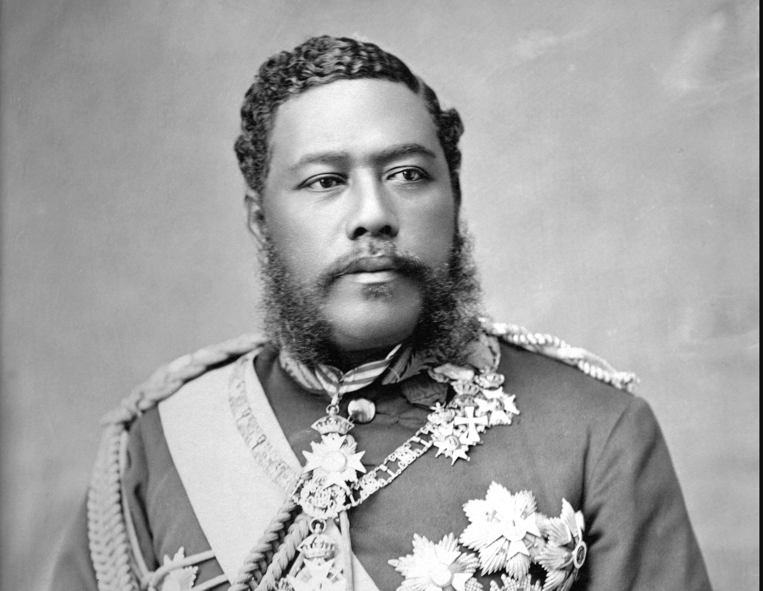 A black and white photo of a man in a military uniform