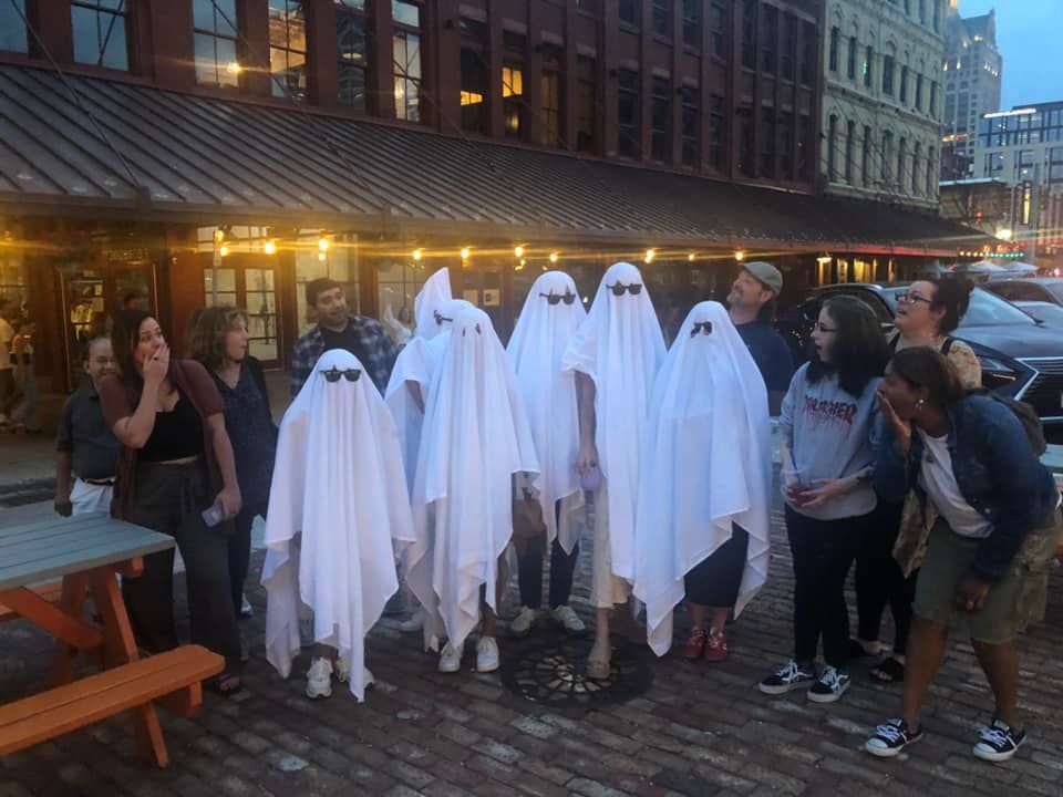 Bachelorette party dressed as ghosts in the Third Ward of Milwaukee