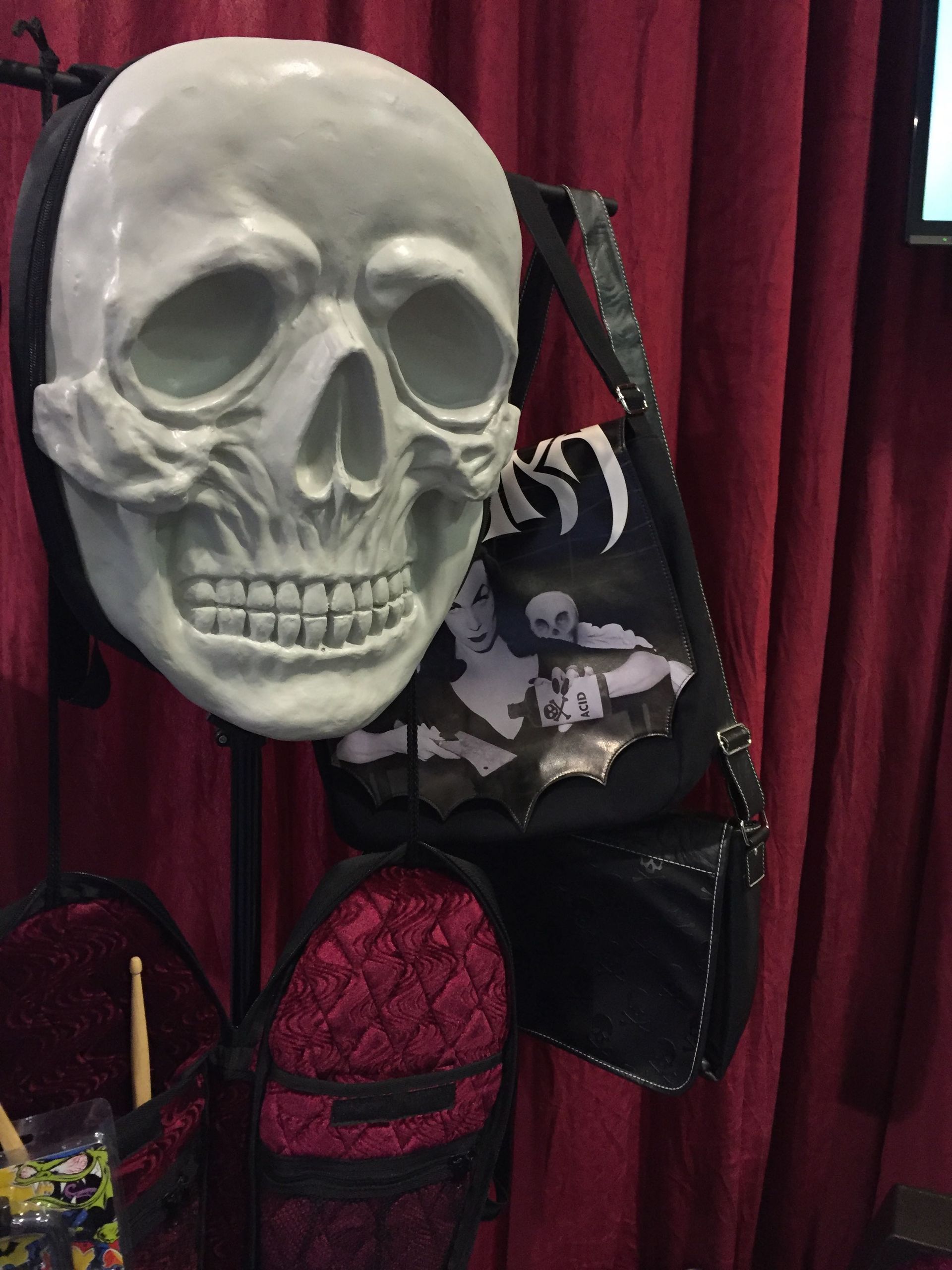 A skull with a headband and a purse on it