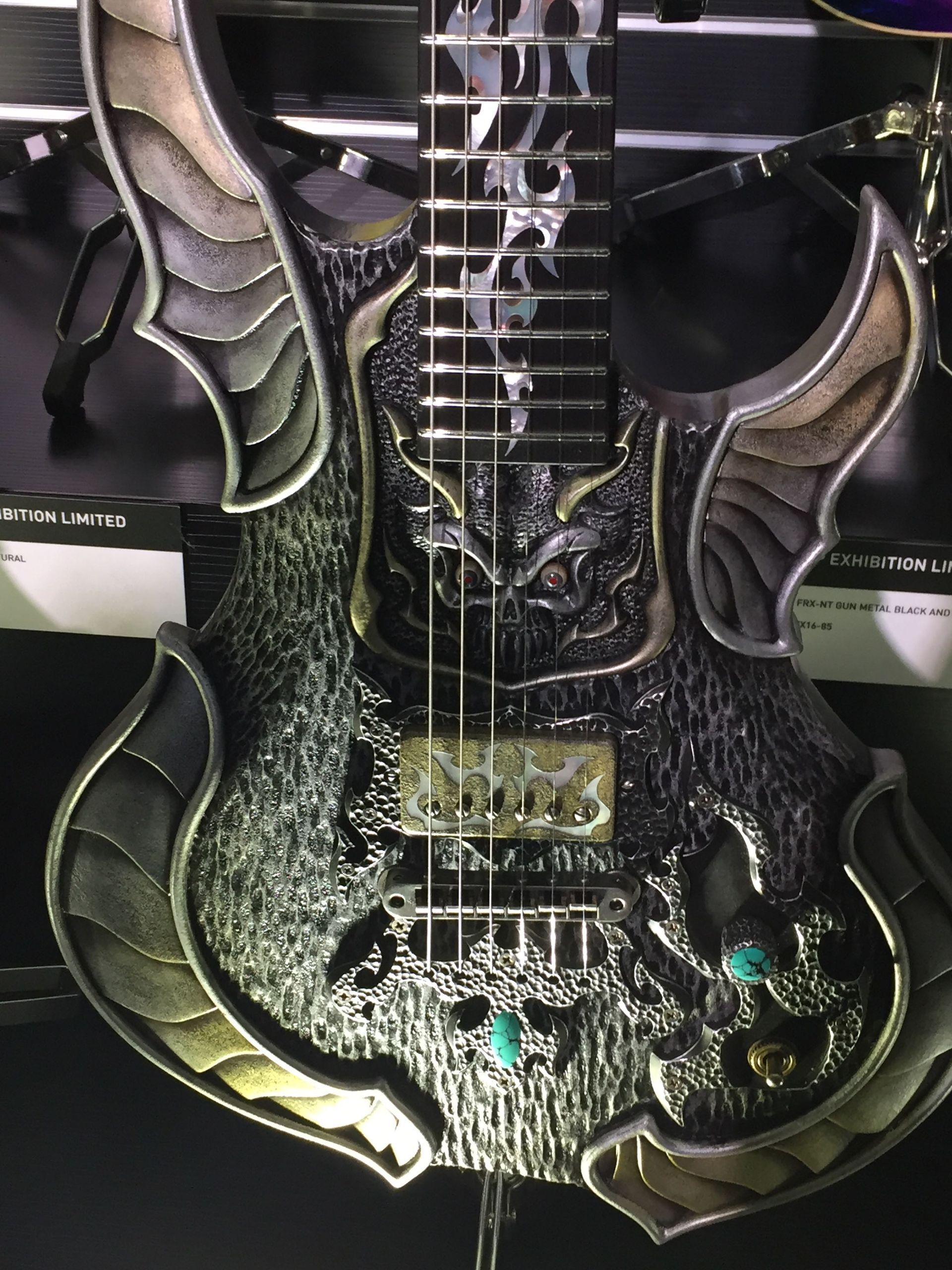 A guitar that looks like a dragon is on display