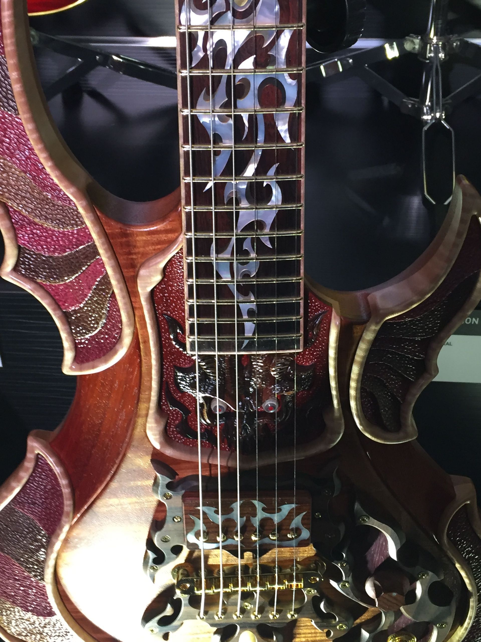 A close up of a guitar with the word jesus on it
