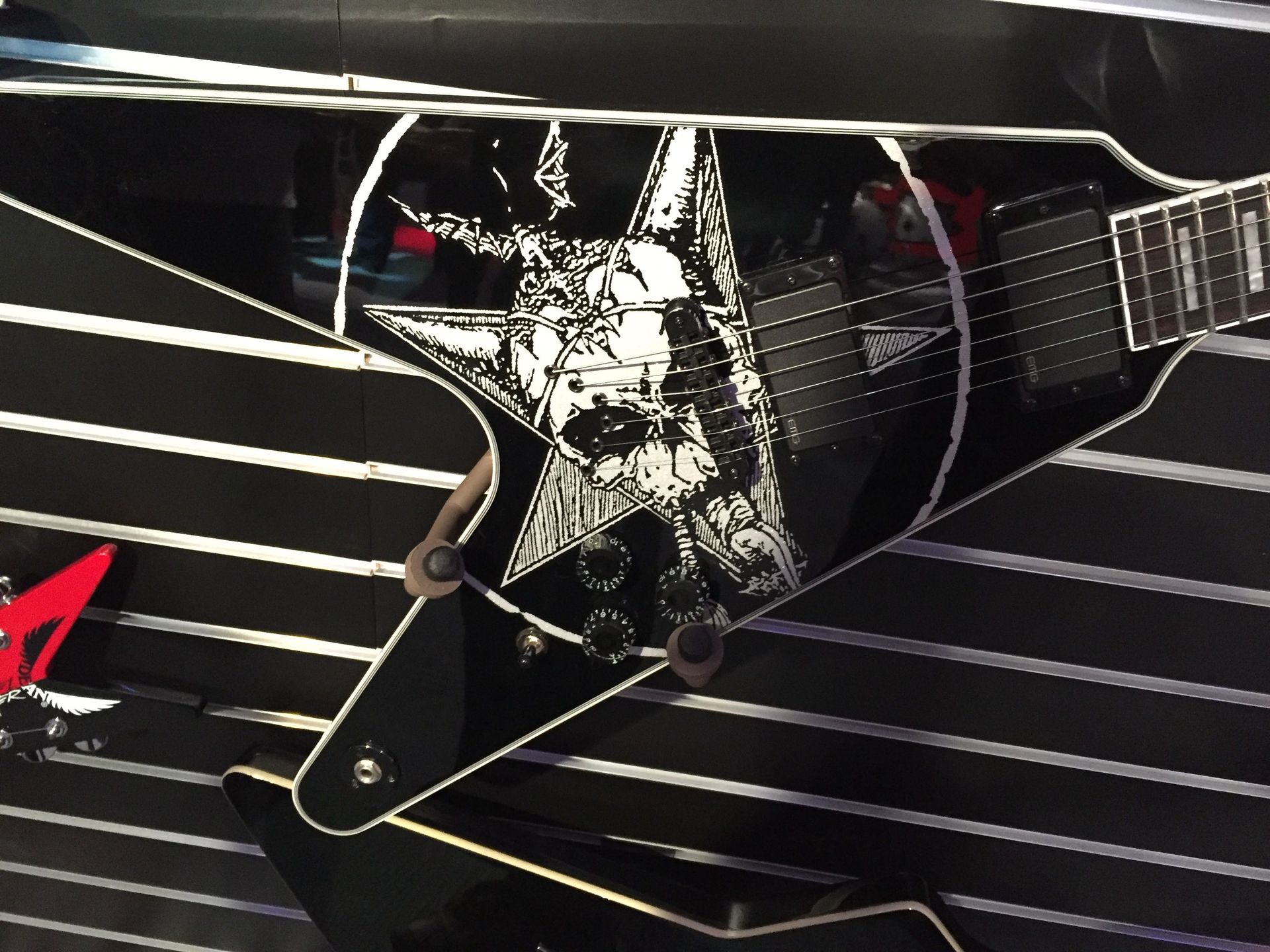 A guitar with a picture of a skull on it