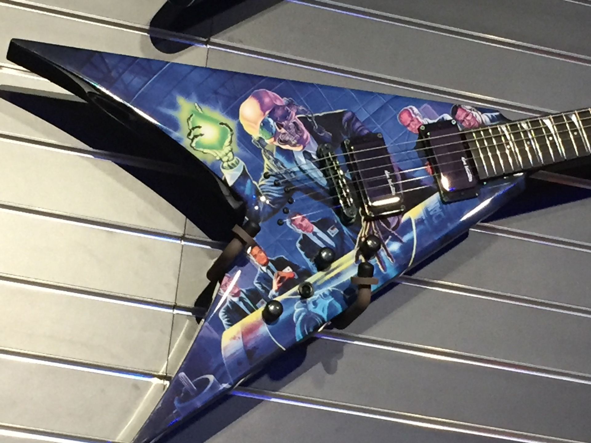 A guitar with a picture of a skull on it