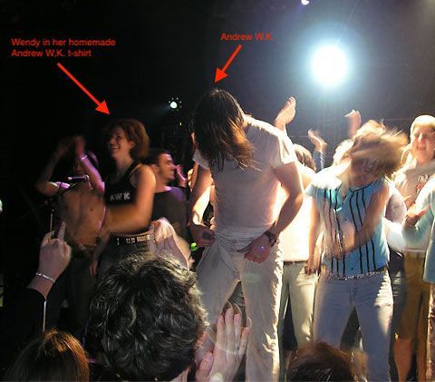 Wendy in her homemade andrew w.k. shirt is dancing in the crowd