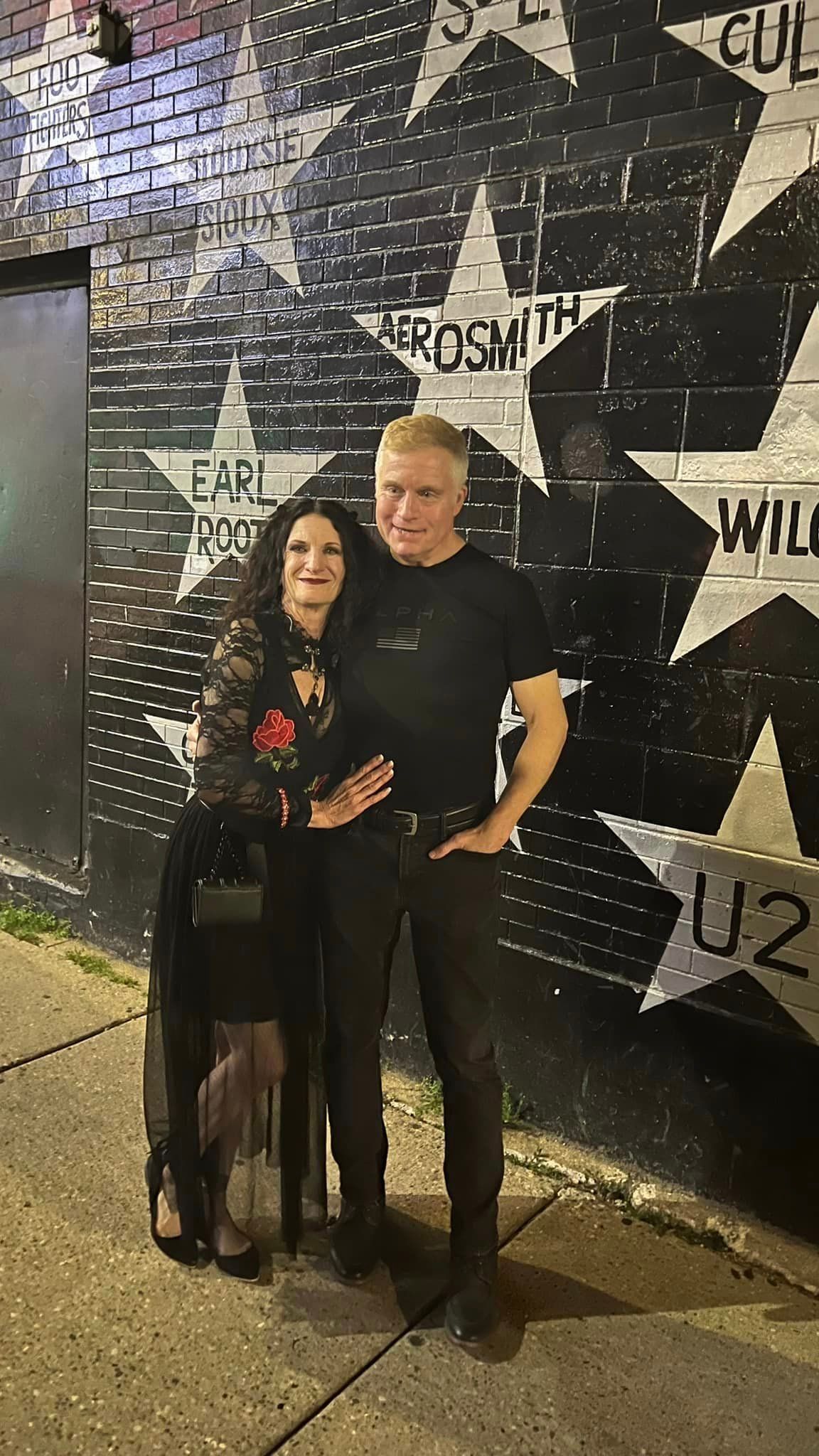 A man and a woman are posing for a picture at the First Avenue