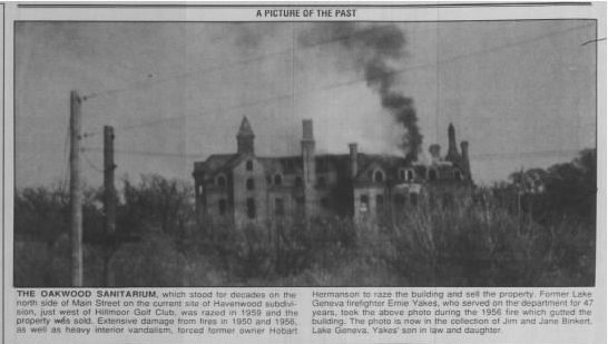 A black and white photo of a building with smoke coming out of it