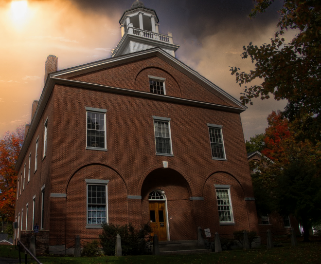 A large brick building with a clock tower on top of it