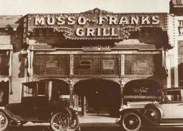 A black and white photo of musso franks grill