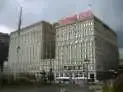 A blurry picture of a large building with a red roof.