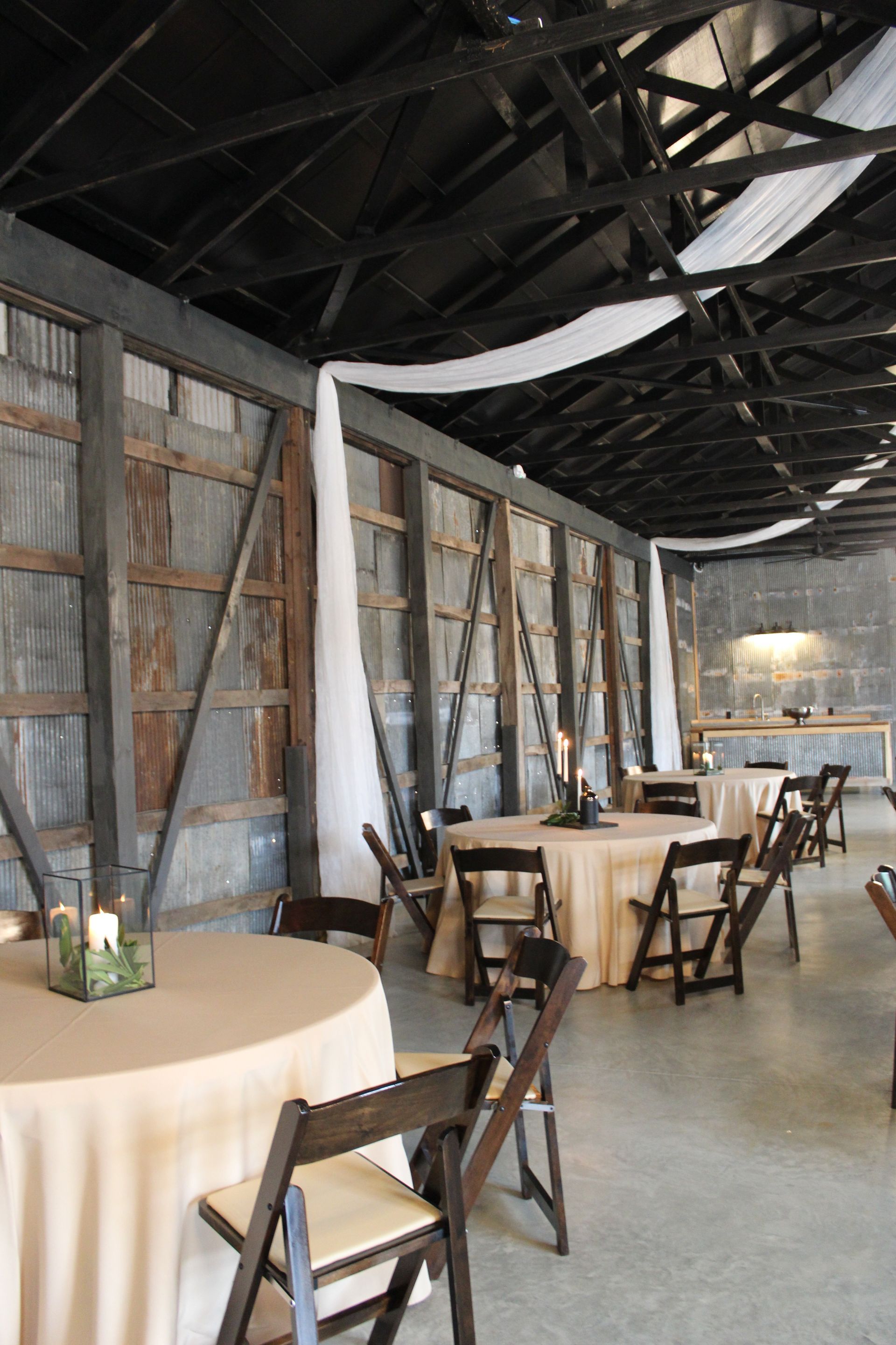 The venue has been thoughtfully transformed with durable metal sheet siding that retains its historic character.