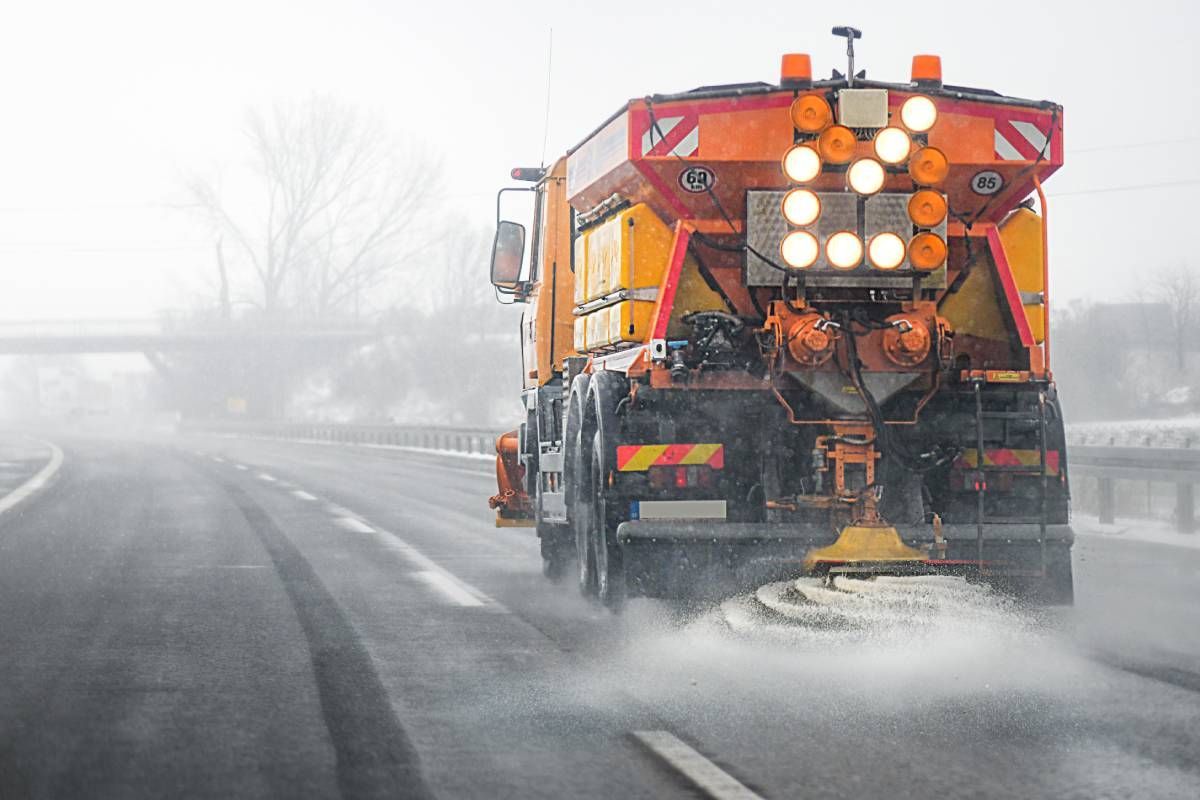 A snow plow salting the roads during a snowstorm near Lexington, Kentucky (KY)