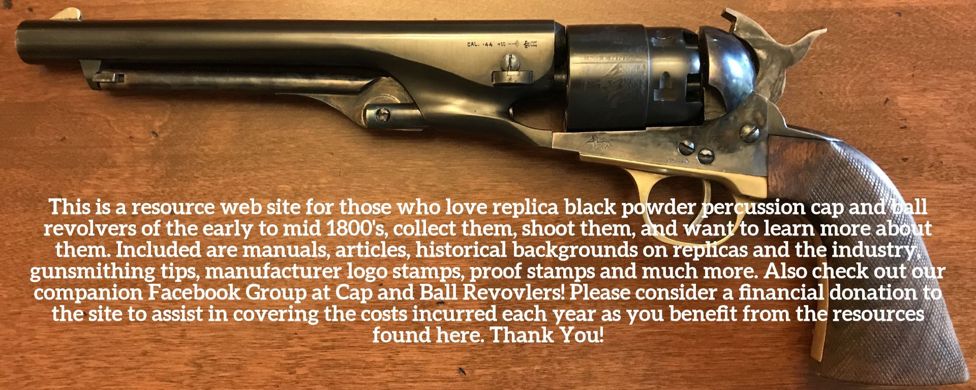 Antique black powder pistol on a wood surface.