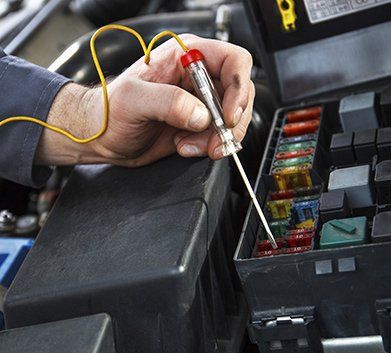 auto electrical solutions mechanic checking for electricals connection