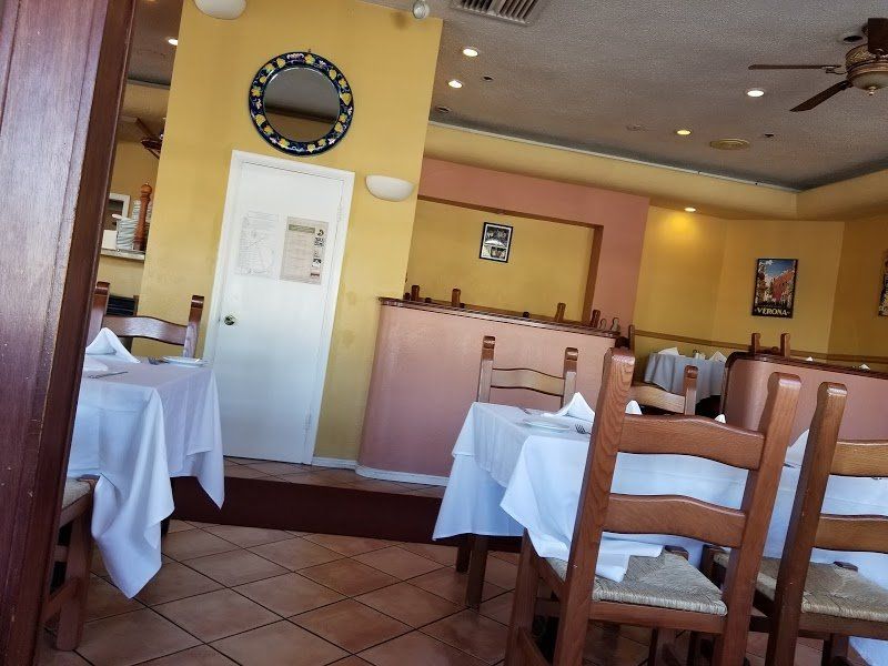 Tables and interior of Mezza Luna Restaurant.