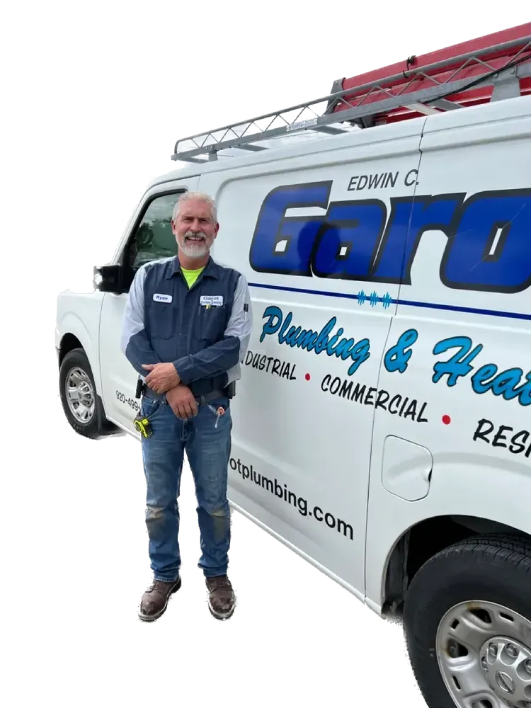 A man is standing in front of a white van.