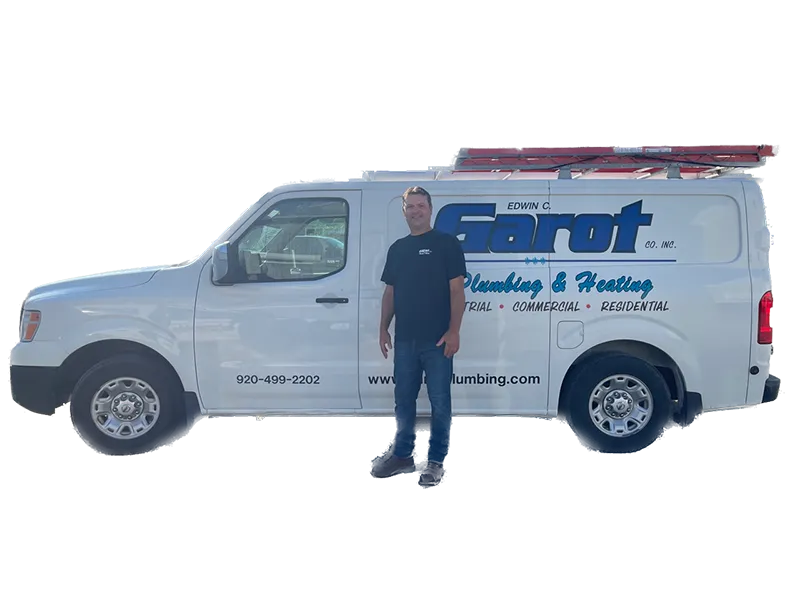 A man is standing in front of a white van.