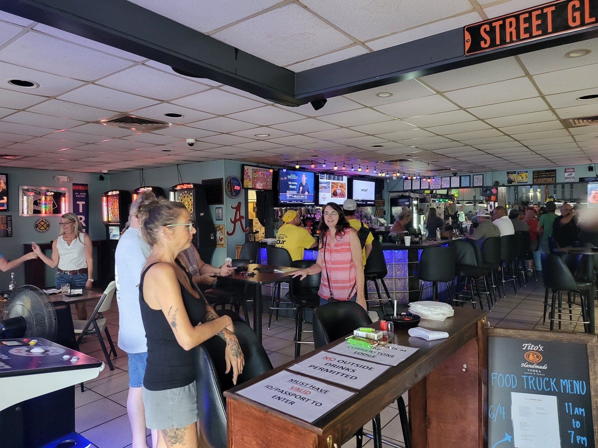 A Group Of People Sitting And Standing At The Bar | Foley, AL | The Office Lounge