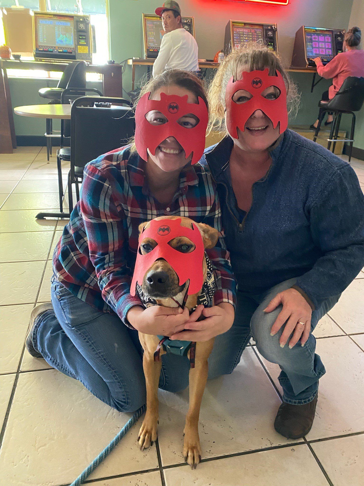 A Couple And A Dog Wearing Mask | Foley, AL | The Office Lounge