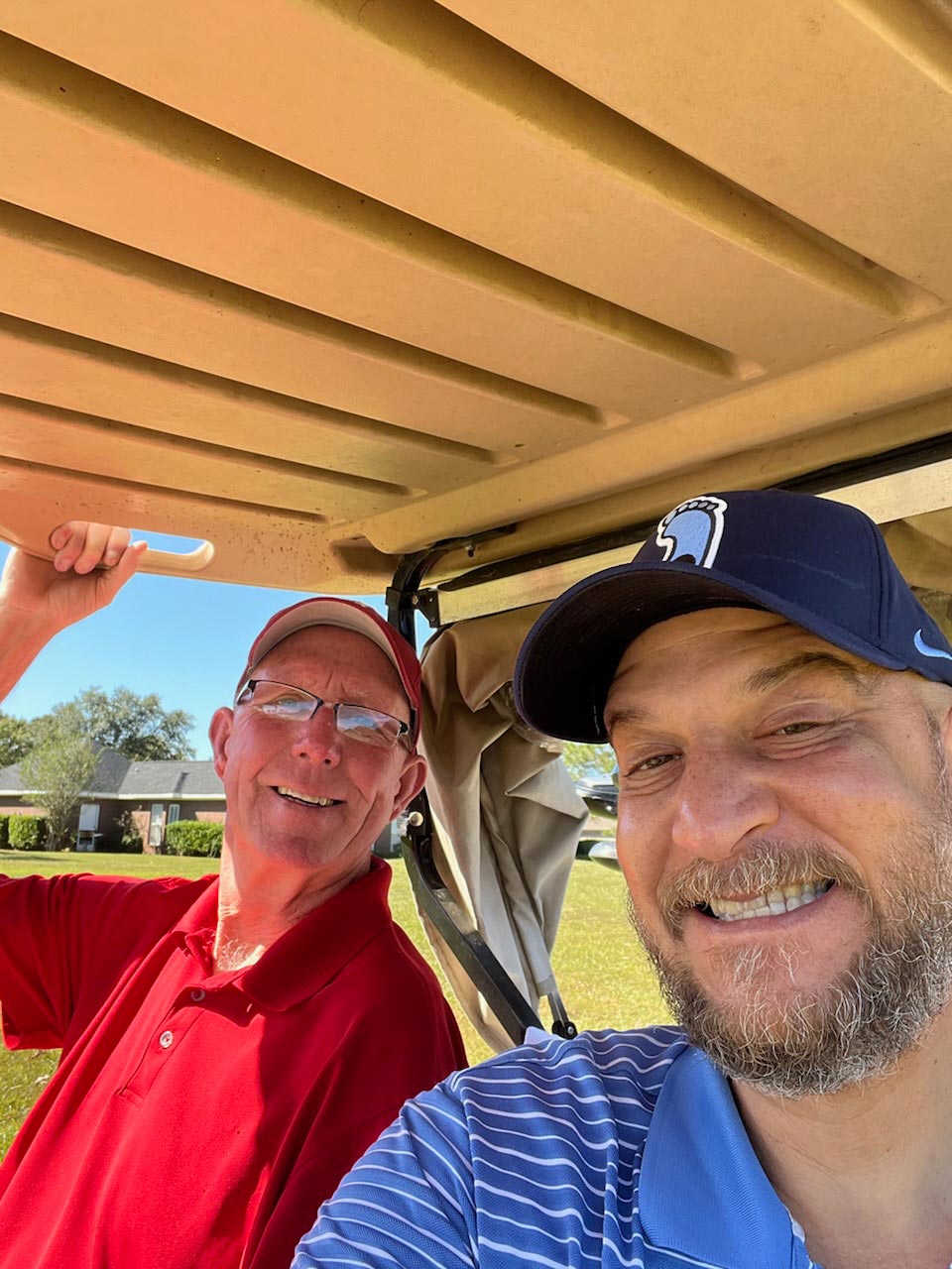 Golfers Riding in Golf Cart | Foley, AL | The Office Lounge