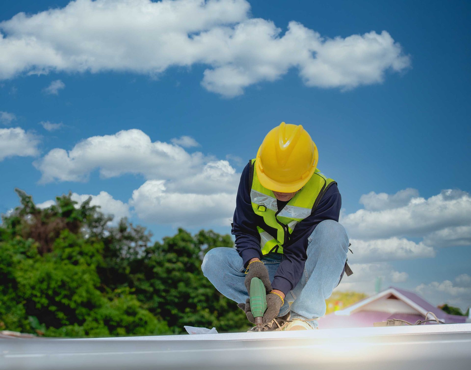 Worker repairing the roof on a construction site. Worker repairing the roof on a construction site.