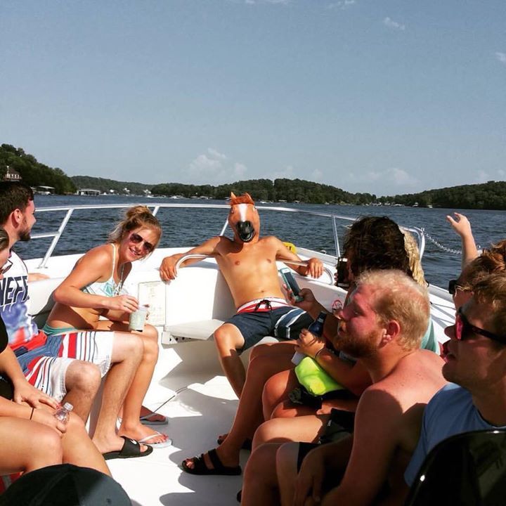 horse mask and party people on Lake of the Ozarks Water Taxi