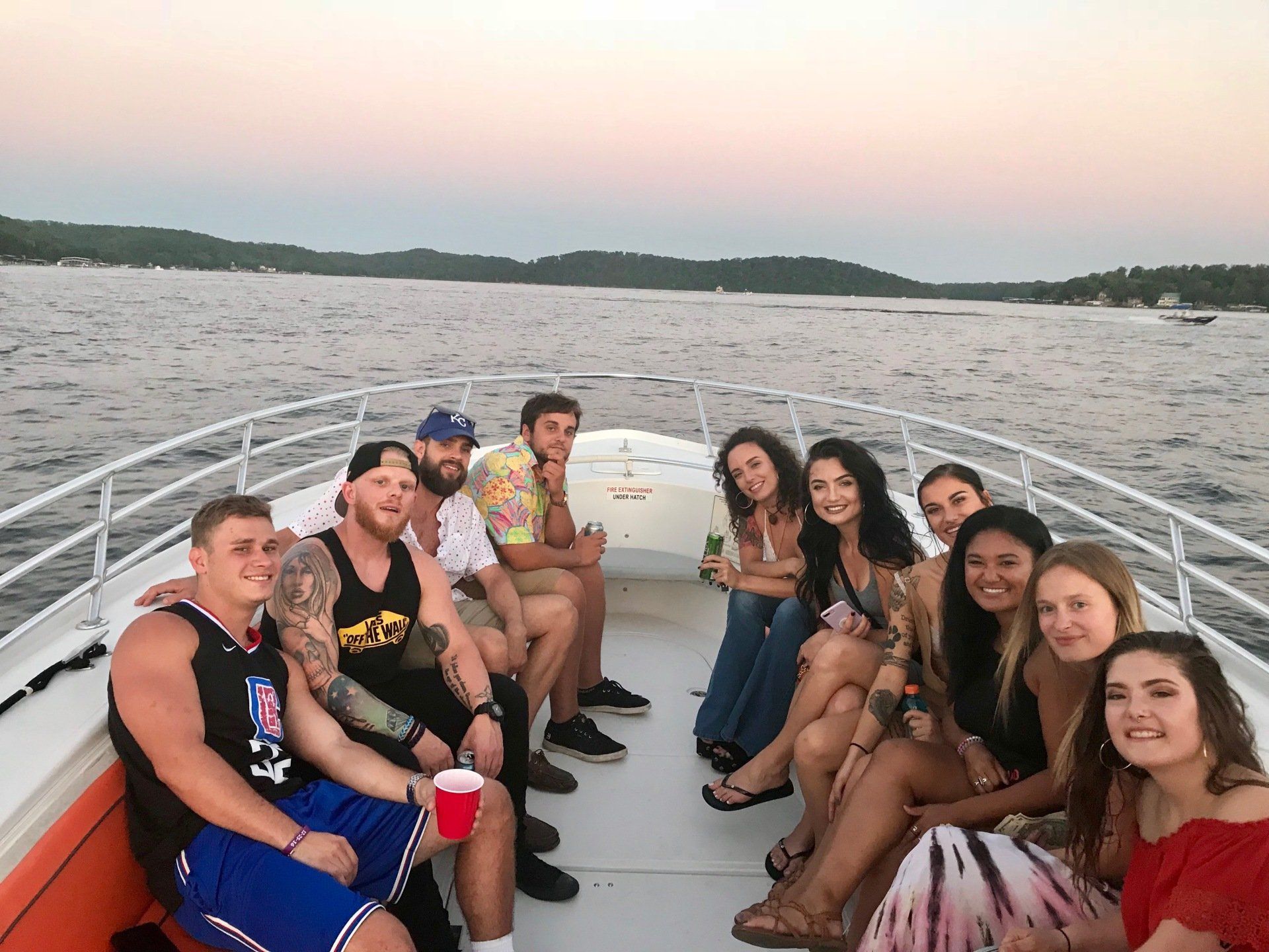 group posing on private charter boat Lake of the Ozarks sunset cruise