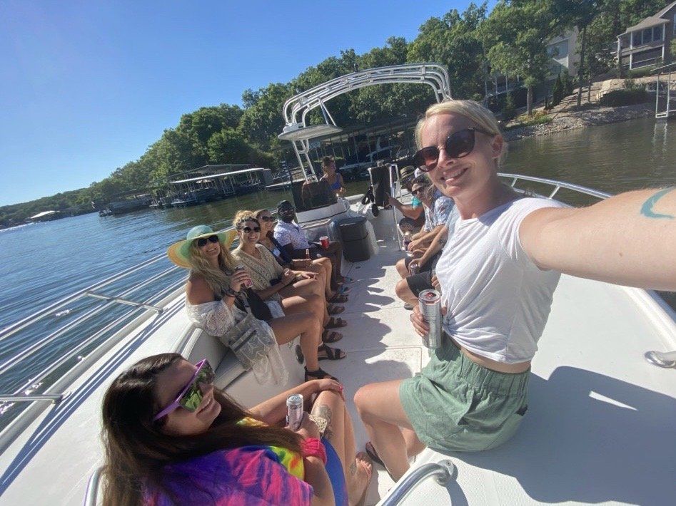 group selfie from front of boat on water taxi
