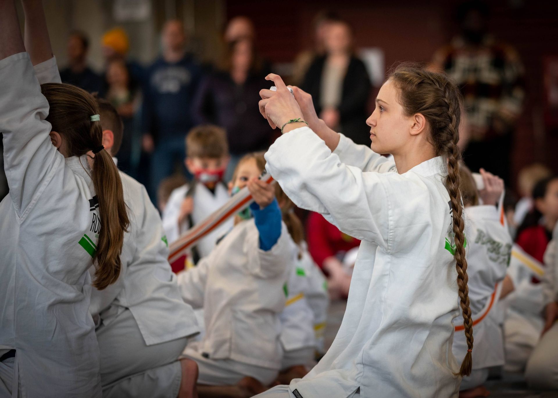 teenagers in martial arts uniforms