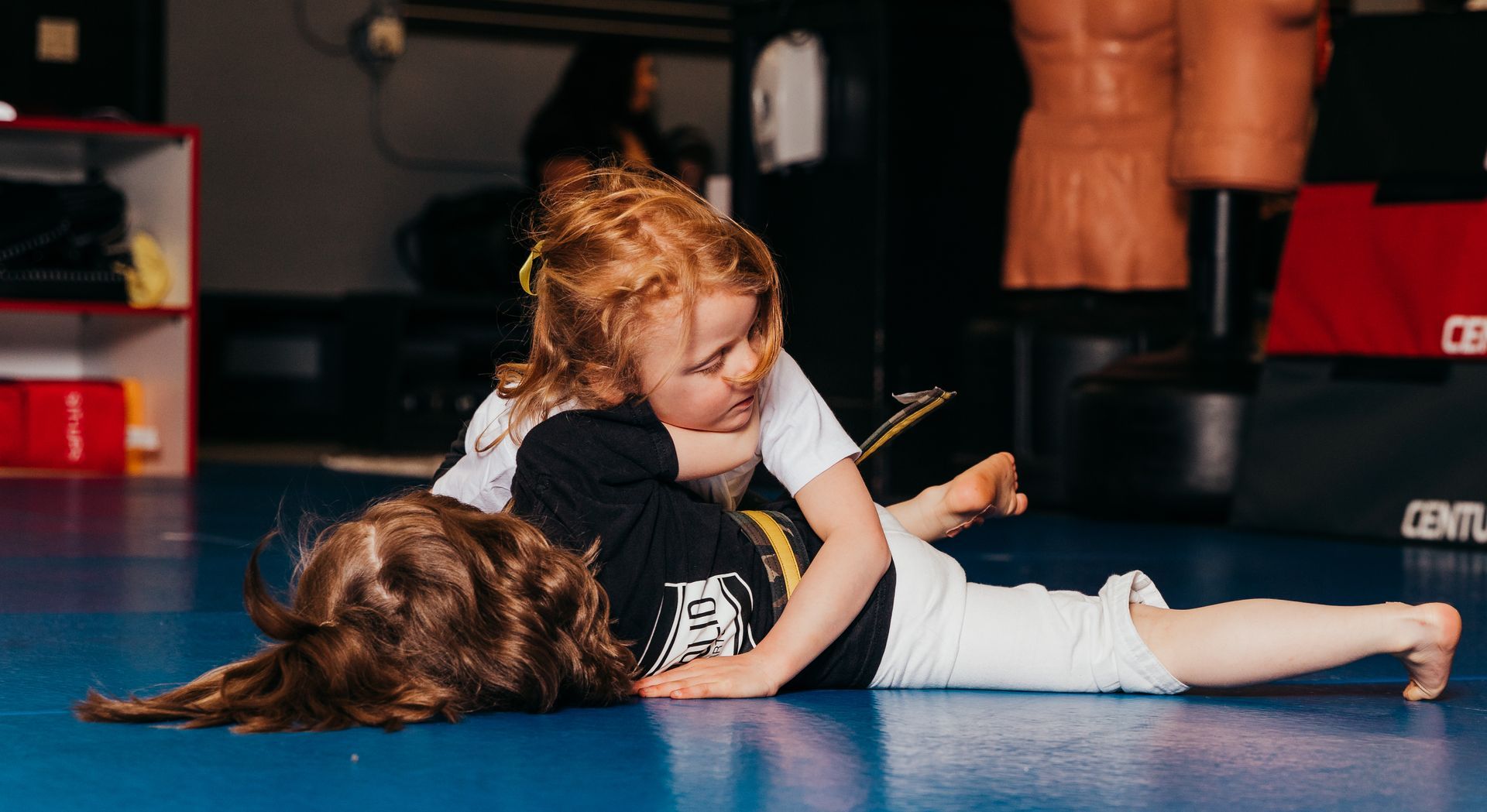 child performing agile martial arts move.