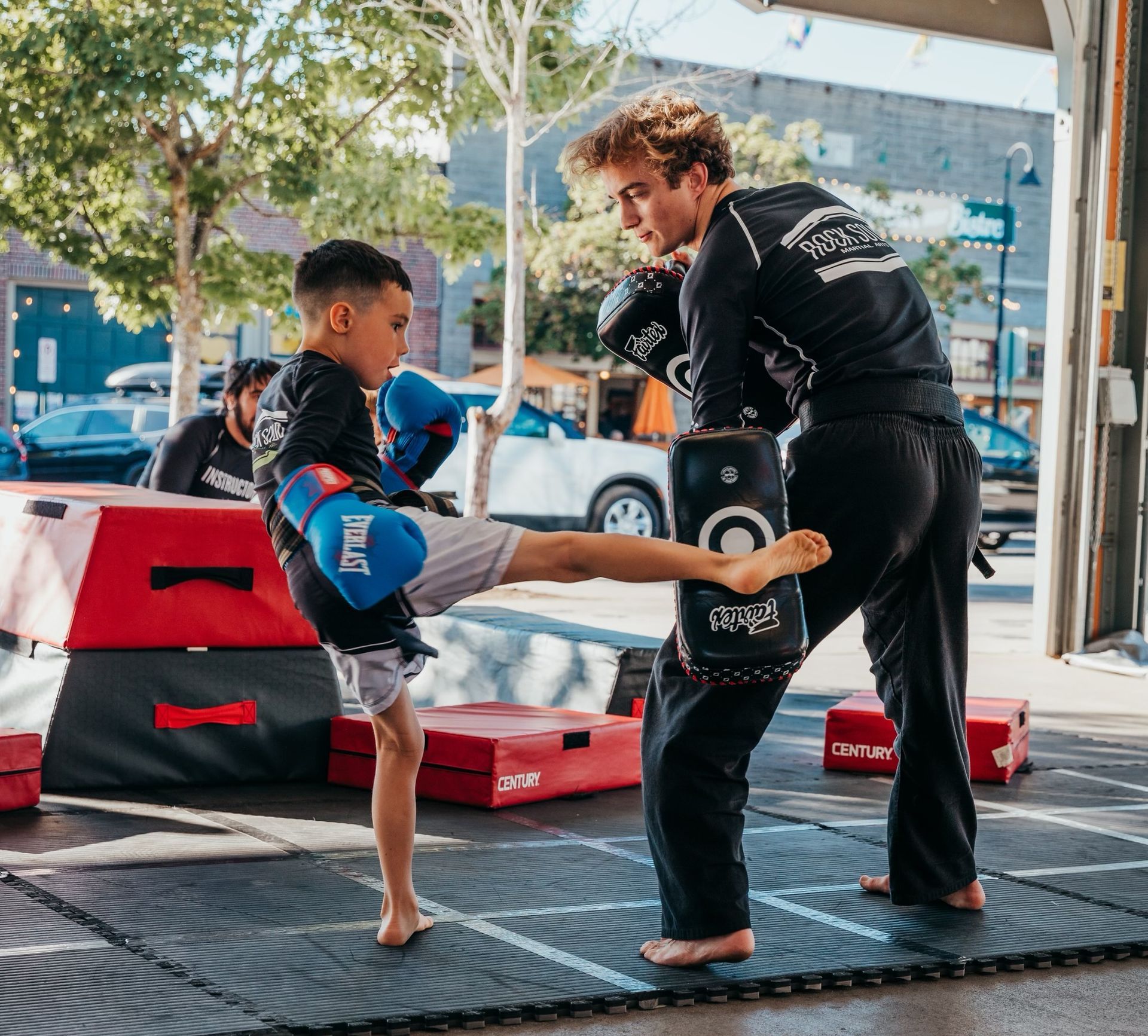 teenage boy executing a perfect martial arts kick