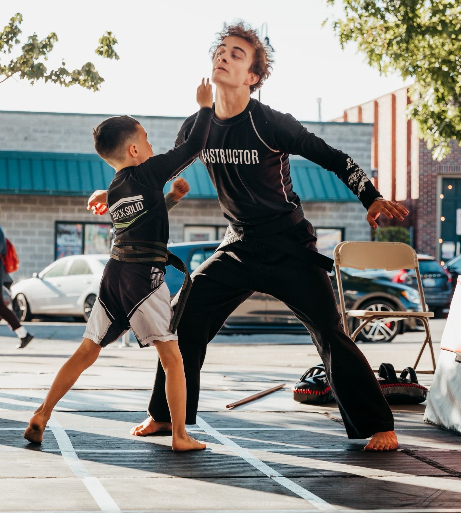 shot of a bustling teenage martial arts class