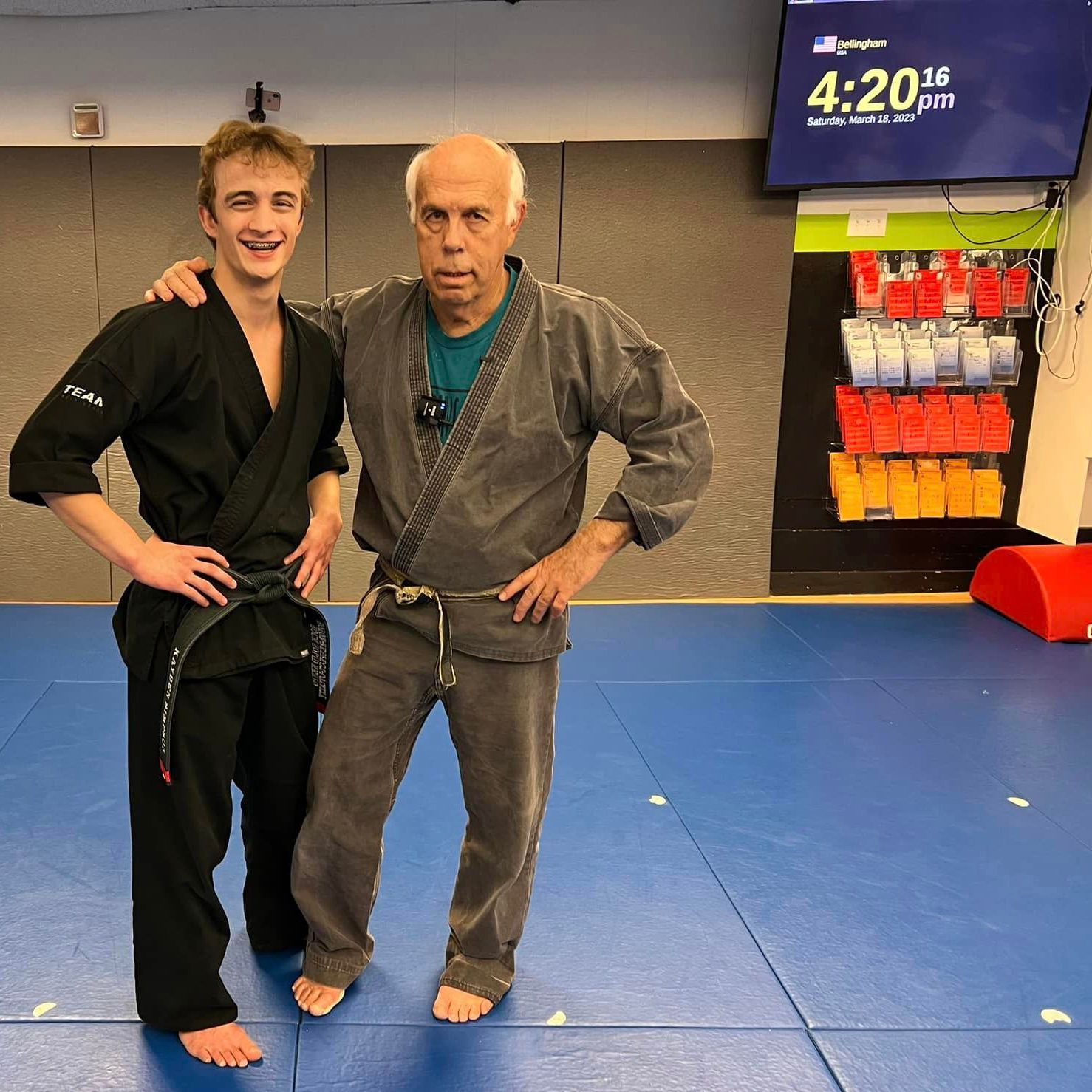BJJ instructor and student posing happily