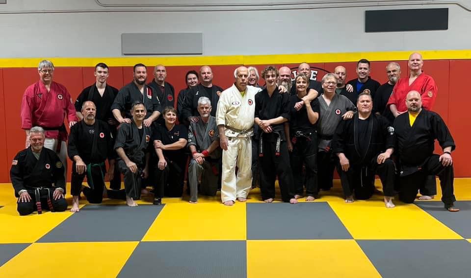 Brazilian Jiu Jitsu instructor and students in a group photo after class