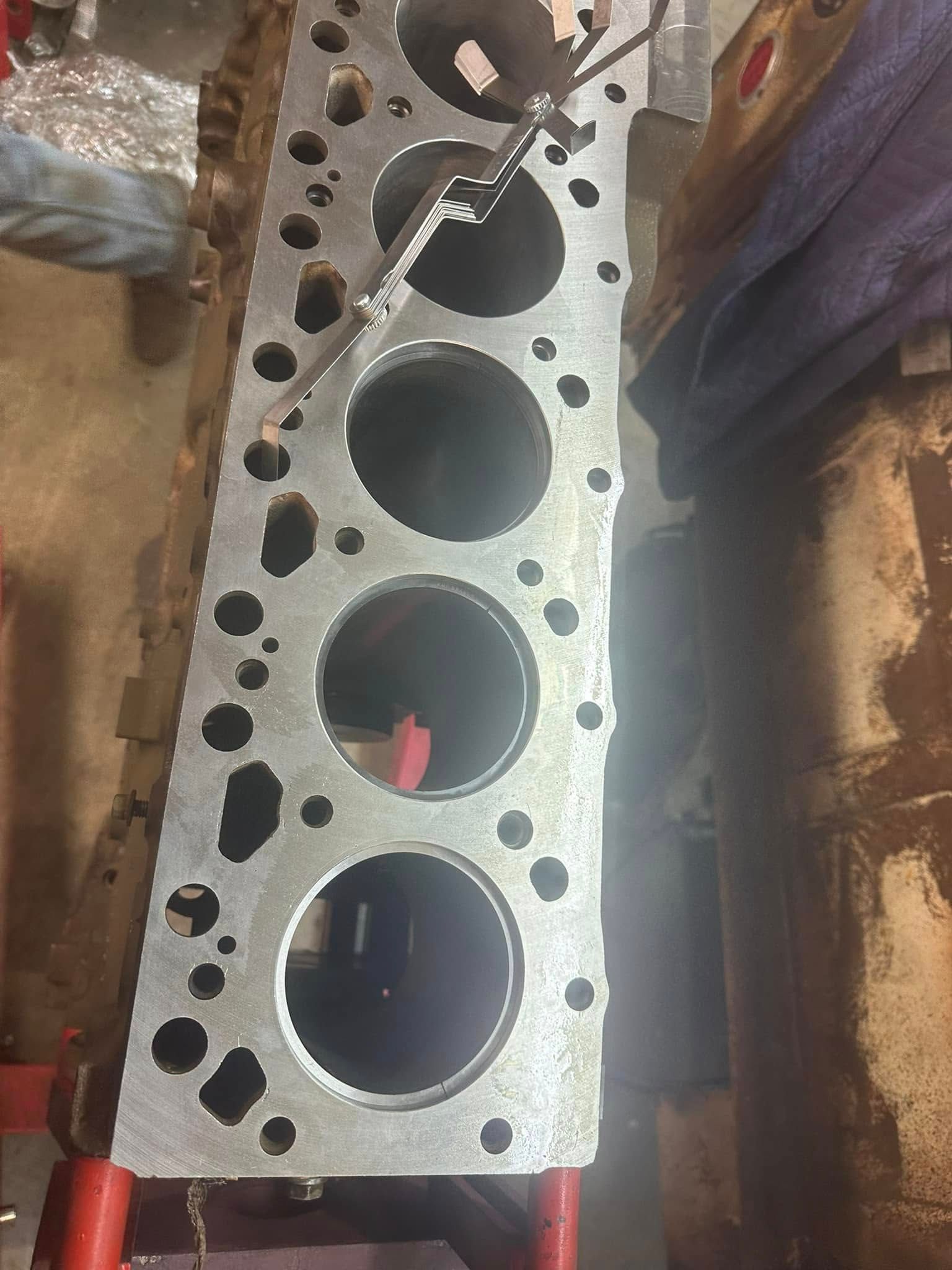 A close up of a cylinder block with holes in it.