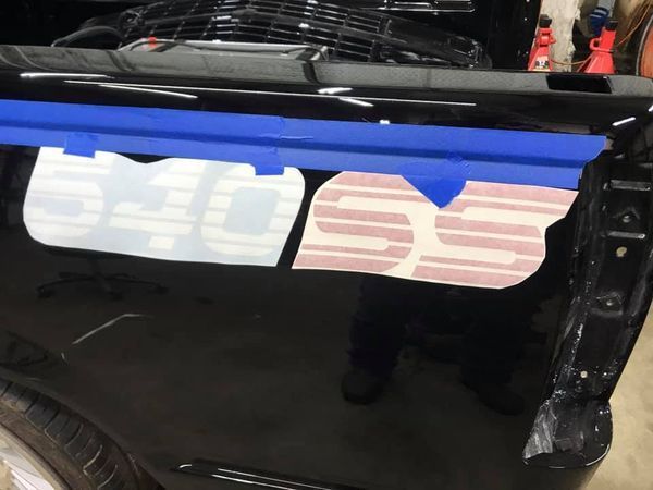 A black truck with a sticker that says ohio on it