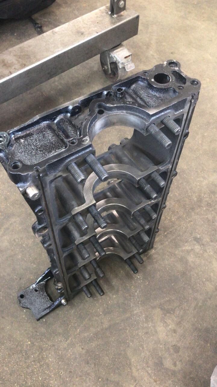 A piece of metal is sitting on top of a concrete floor.