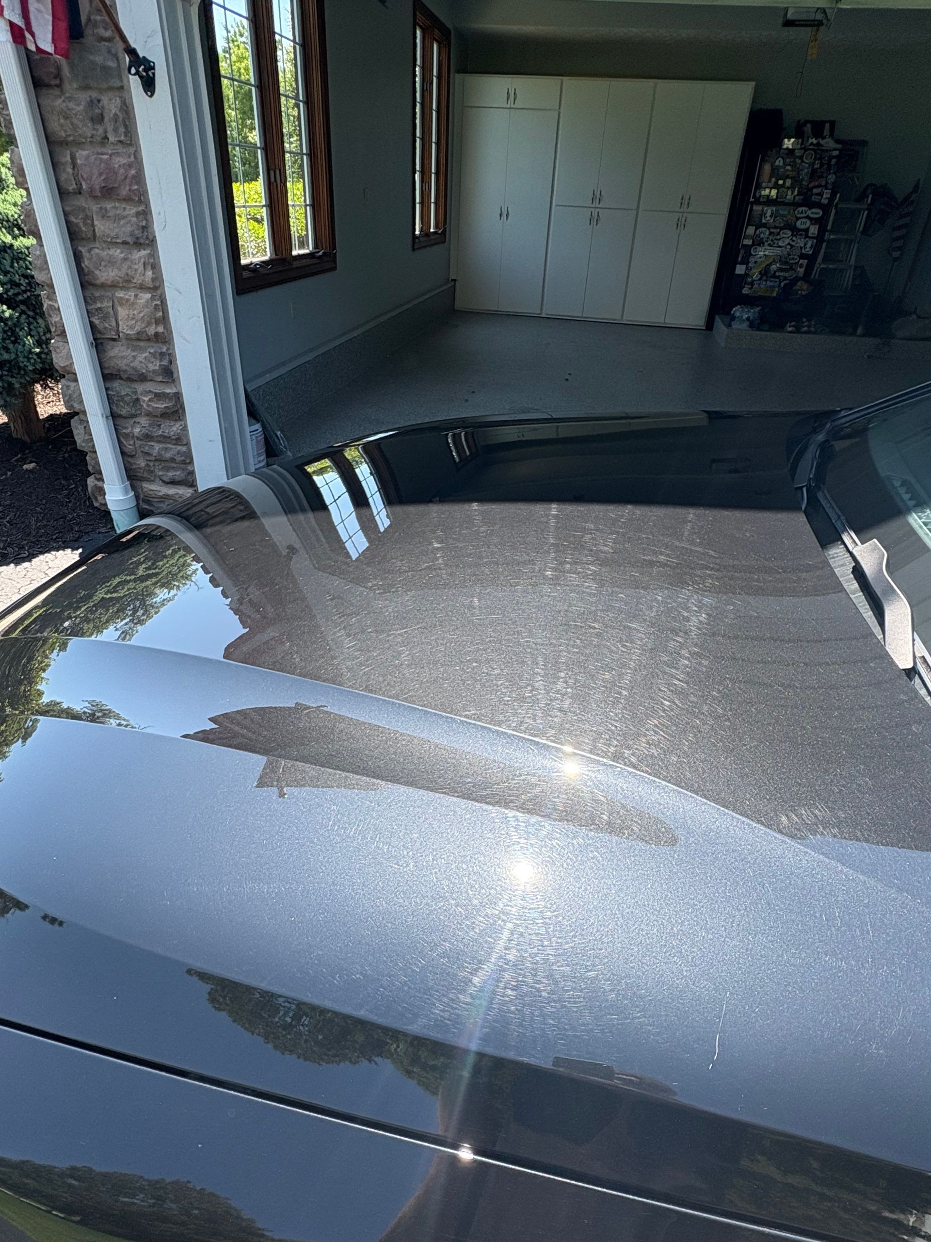 Interior view of a car featuring a red seat, black steering wheel with Honda emblem, and a partially open sunroof.