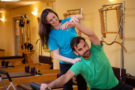 Man on Pilates Reformer