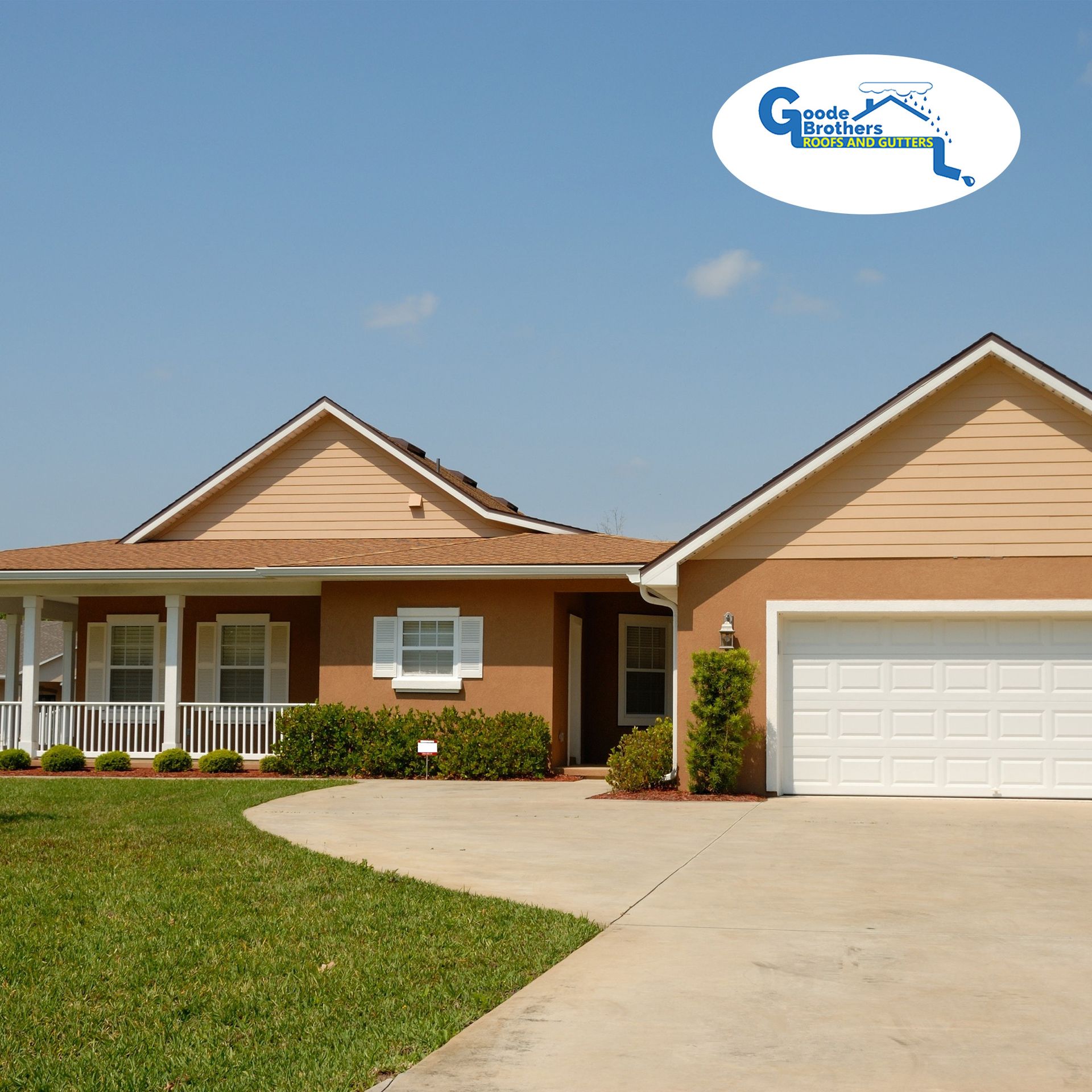 Single-story tan stucco home with a white garage door, front porch, and driveway under a blue sky, with a company logo.