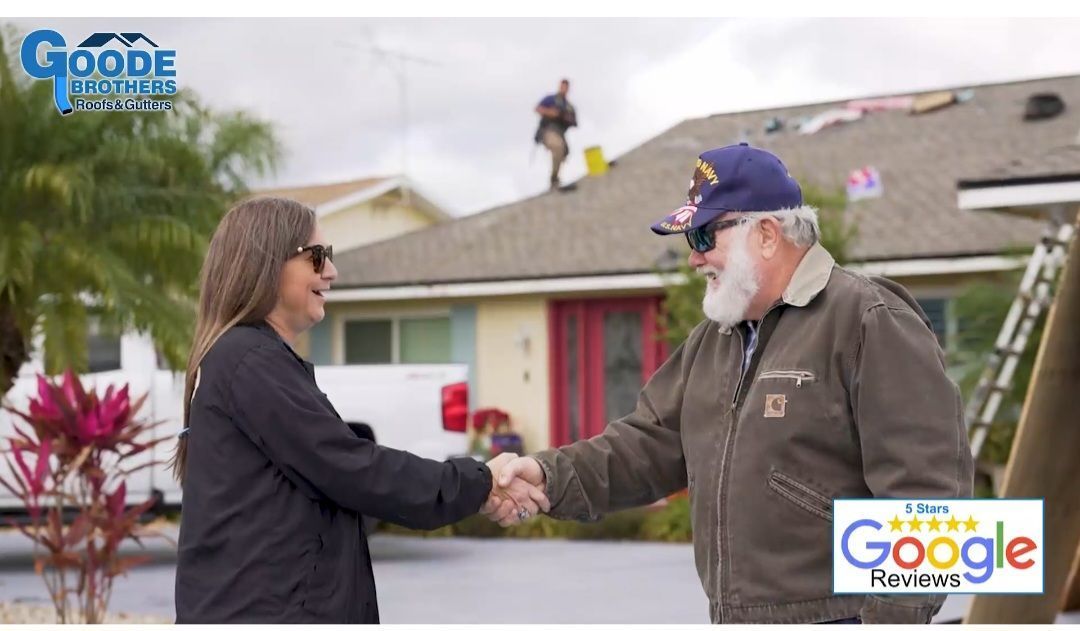 A woman and a man shake hands in front of a house where a worker is on the roof. A Google reviews logo is in the corner.