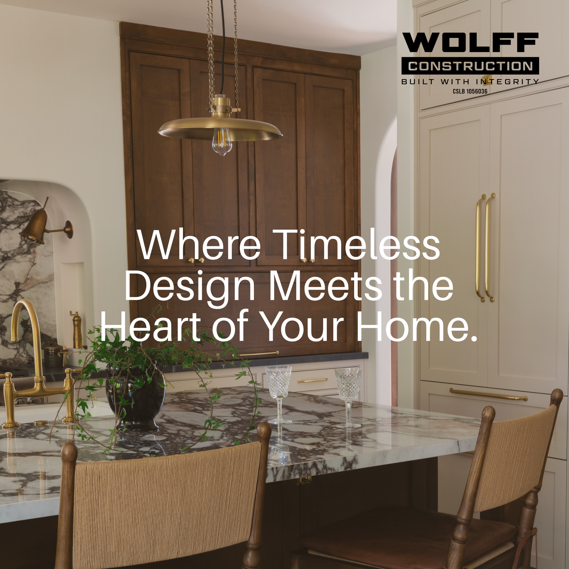 Wolff Construction completed luxury kitchen remodel featuring custom cabinetry, marble island, and timeless design slogan.