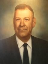 A portrait of a man in a suit and tie.