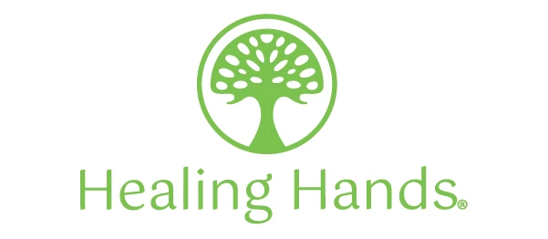 A logo for healing hands with a tree in a circle
