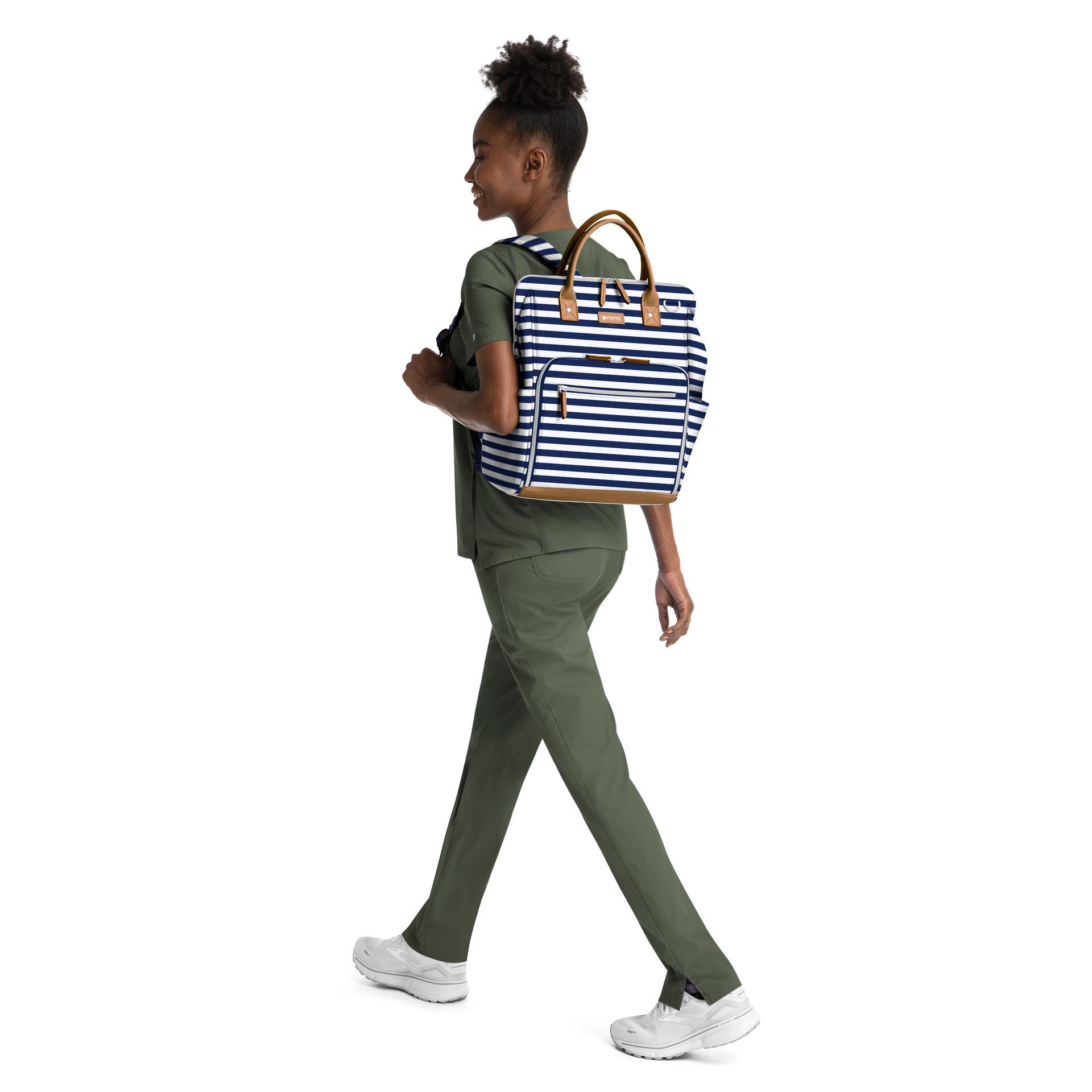 A nurse is walking with a backpack on her back.