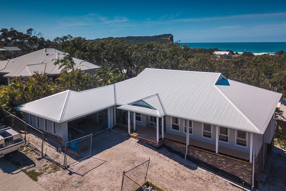 Simple House With Metal Roofing — Roofing in Bonny Hills, NSW