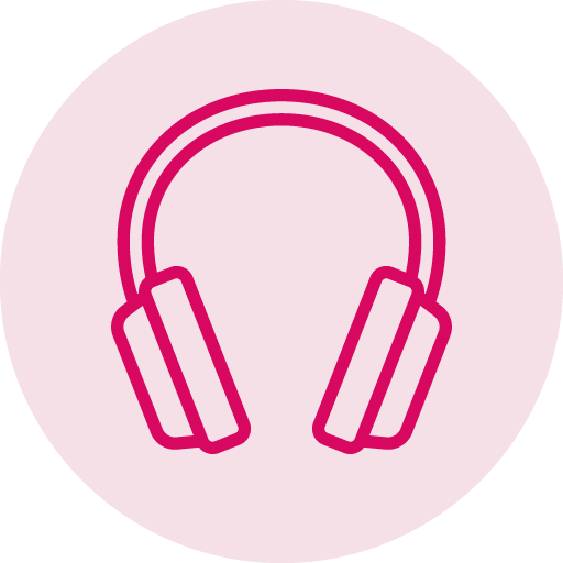 A pair of pink headphones on a pink background