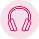 A pair of pink headphones on a pink background